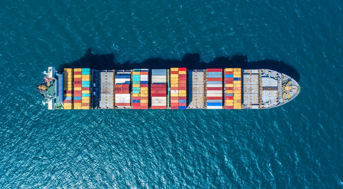 container ship in import export and business logistic.By crane ,Trade Port , Shipping.cargo to harbor.Aerial view.Top view.